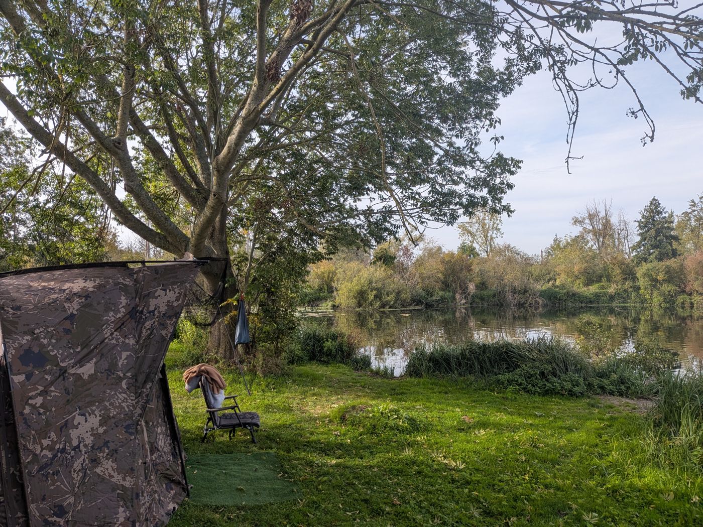 Carp swim with bedchair facing the pond