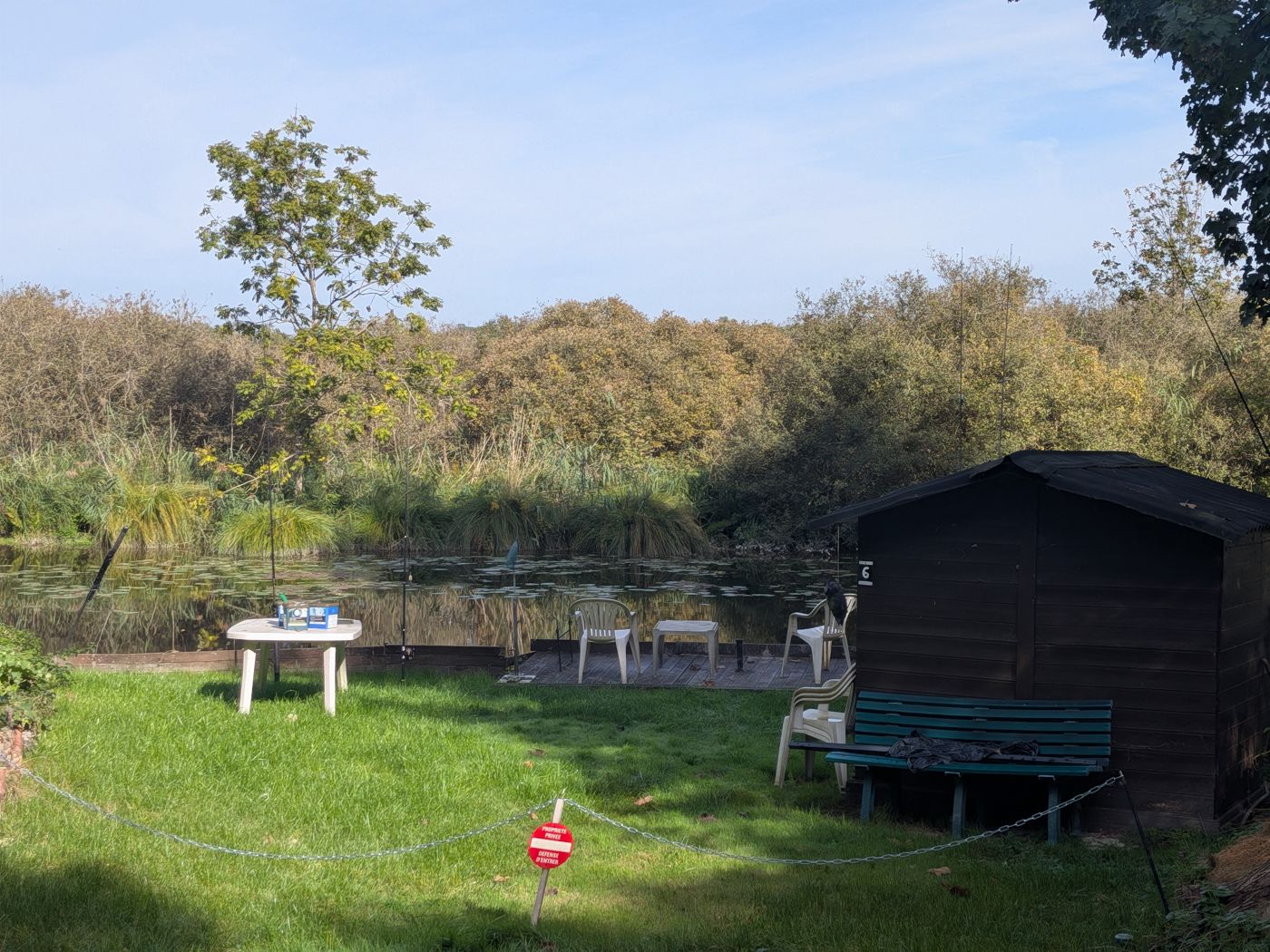 Private fishing pitch with hut, table and bench
