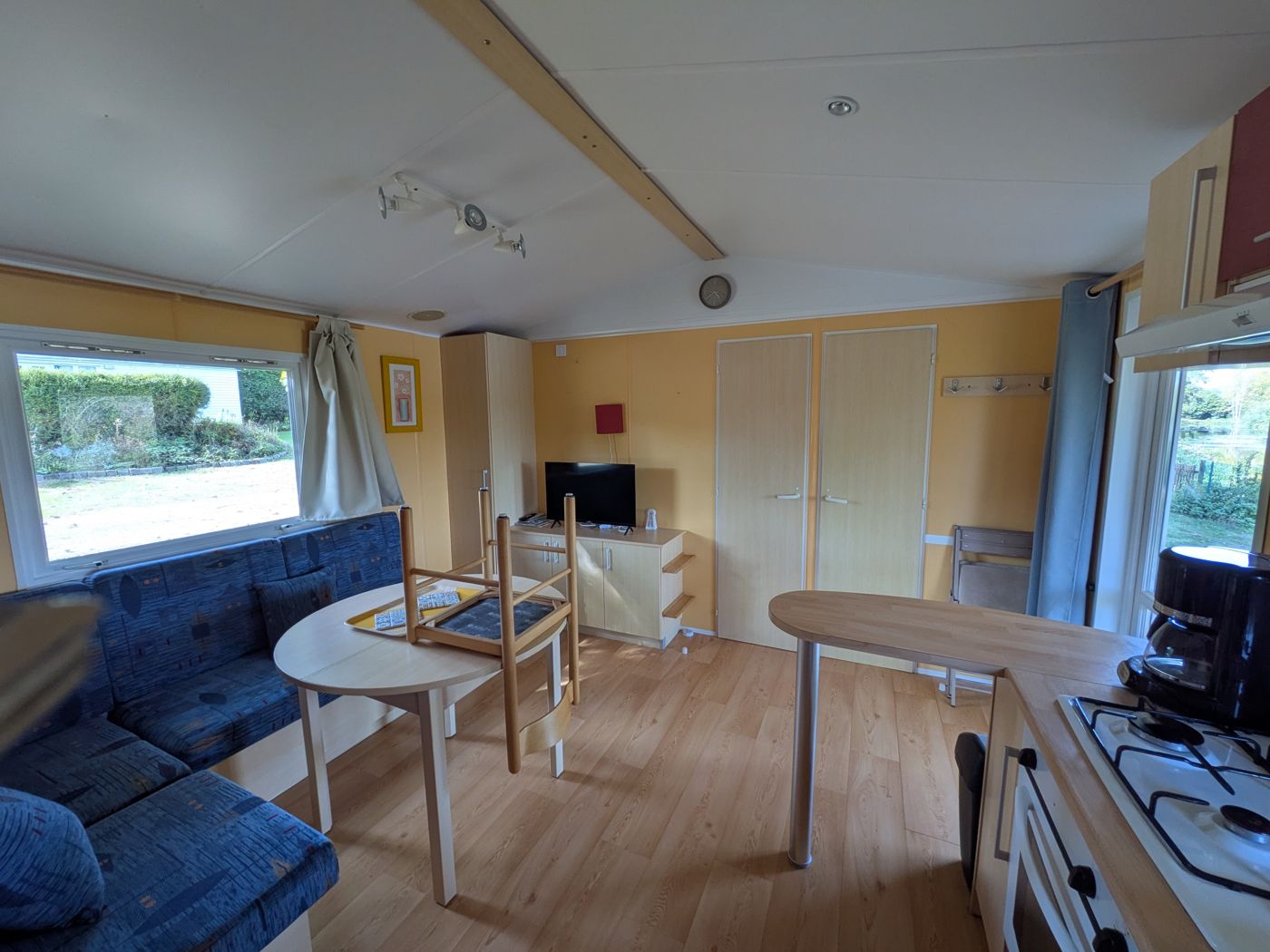 Mobile home living room with sofa and dining area