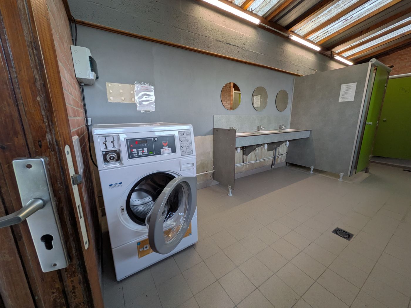 Washing machine in the toilet block (tokens at reception)